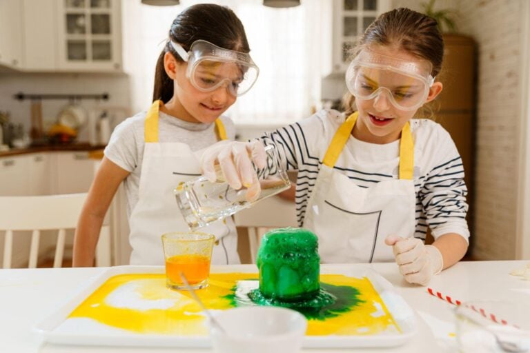 Children doing hands-on STEM activities with everyday household materials at a kitchen table